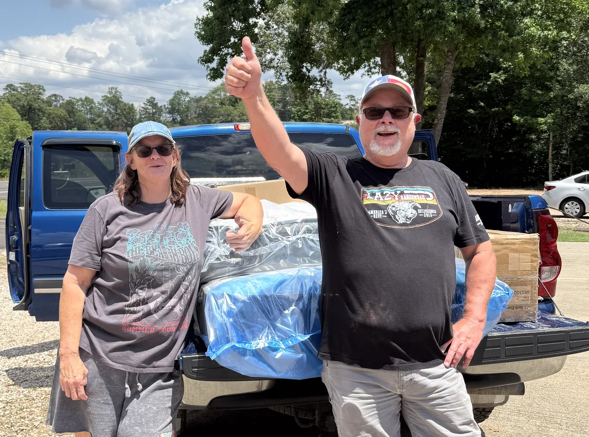 Happy local customers picking up a mattress