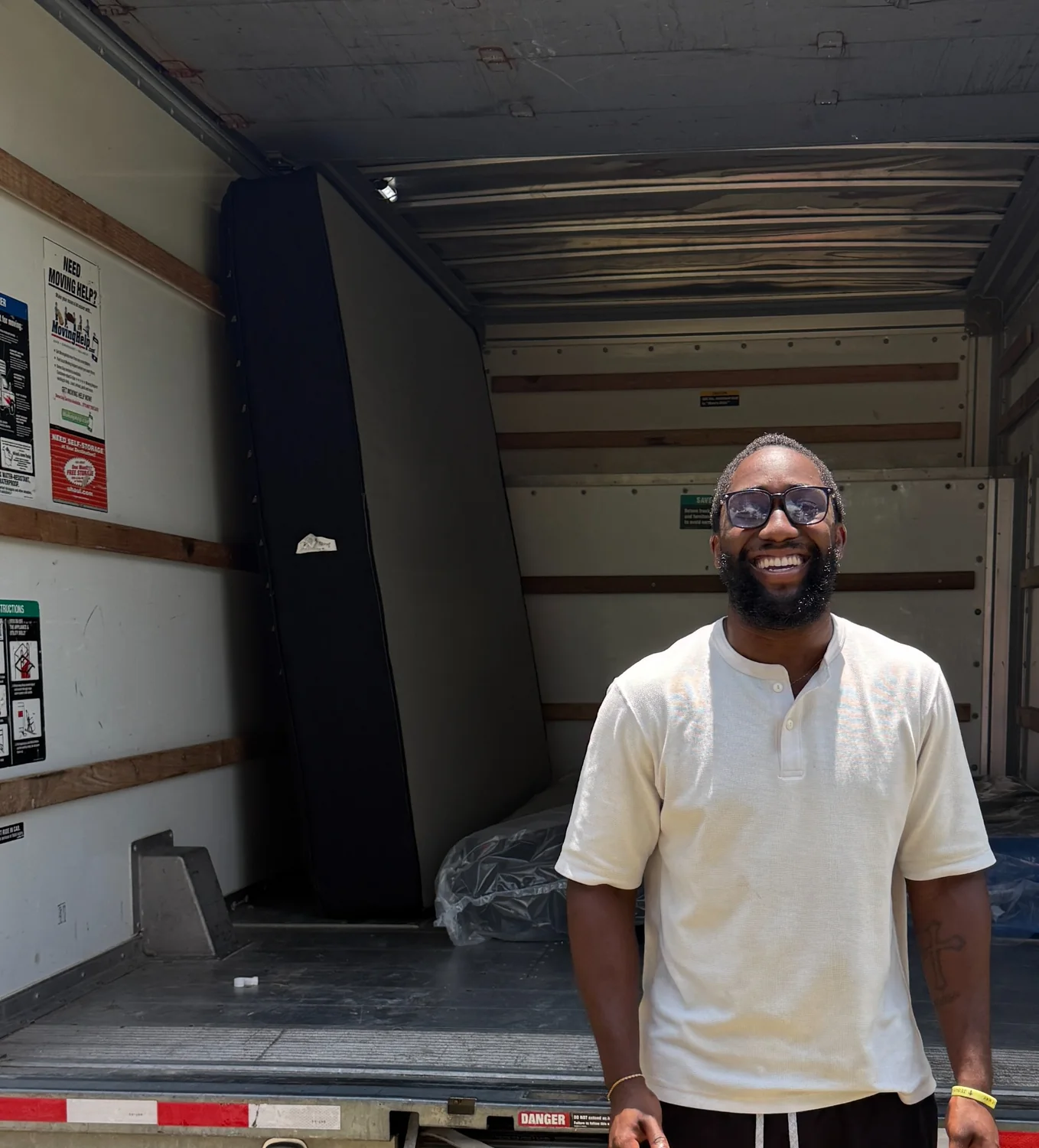 Shawn standing in front of his truck after buying a mattress