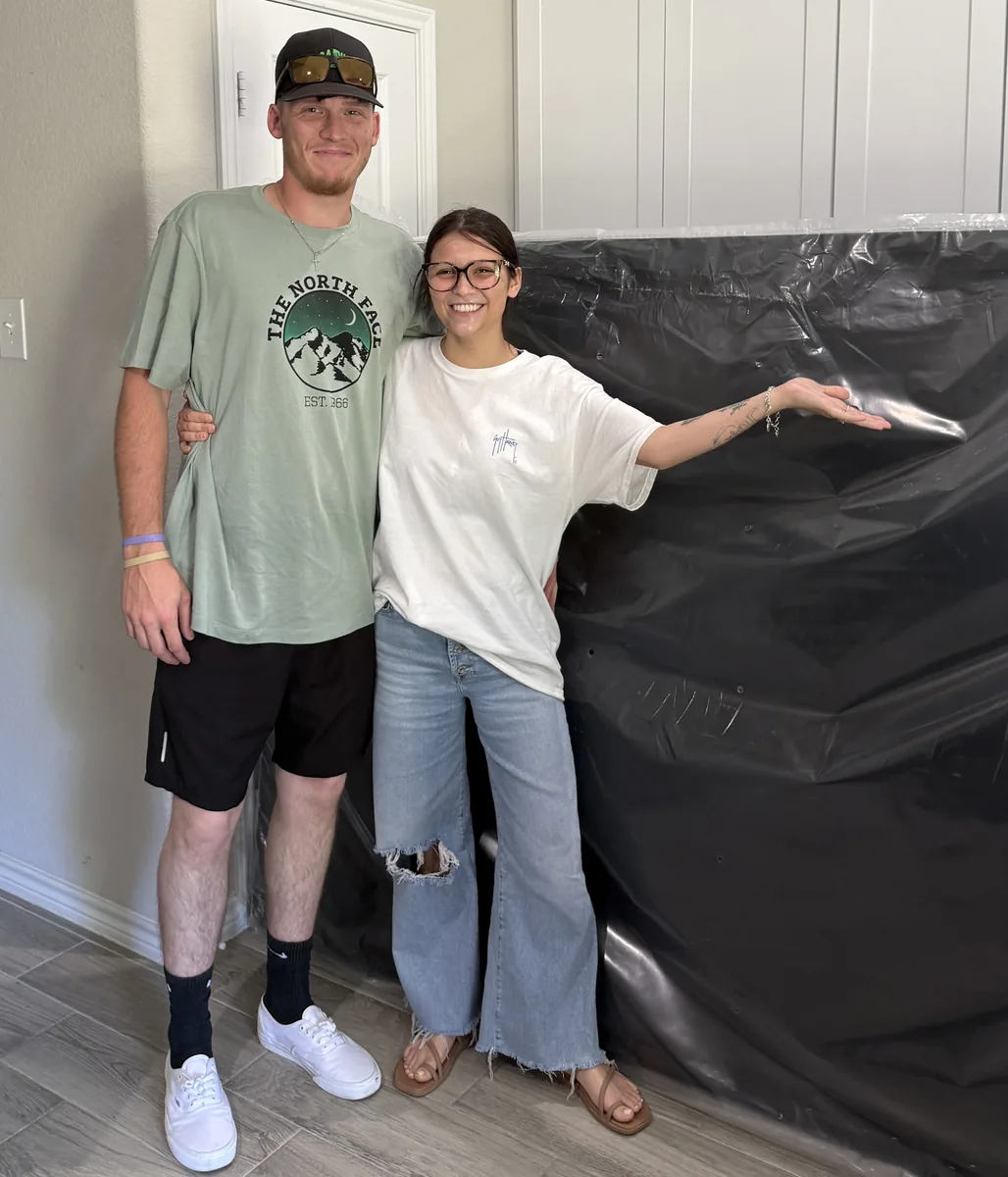 Happy customers with a new mattress